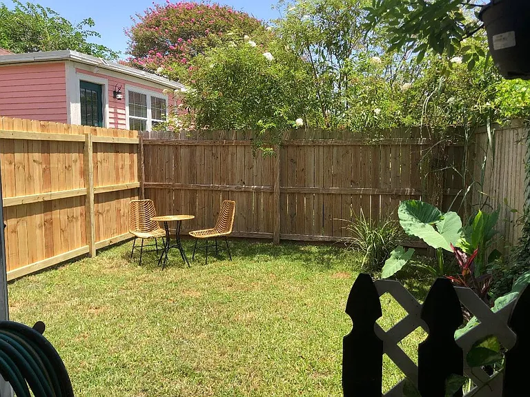 another view of the backyard from the outdoor shower