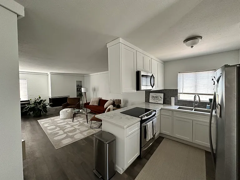 Shared, furnished living room and fully stocked kitchen