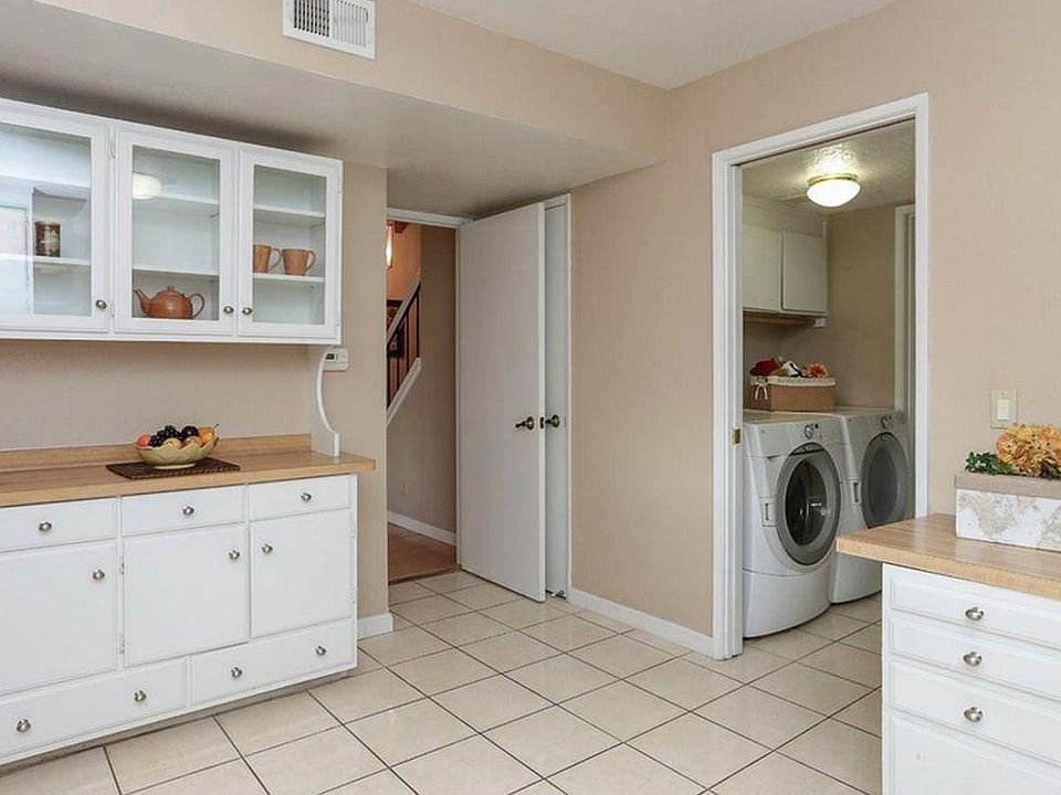 Washer and dryer in home, next to kitchen