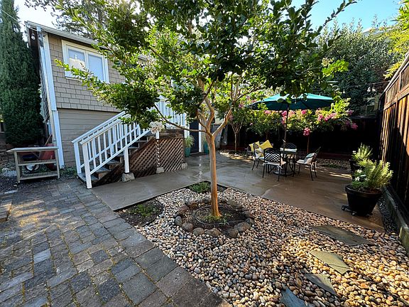 Private patio garden now with outdoor overhead lighting and gas BBQ