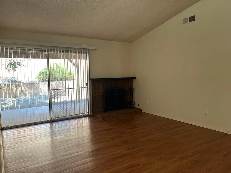 Living room with fireplace and large sliding door