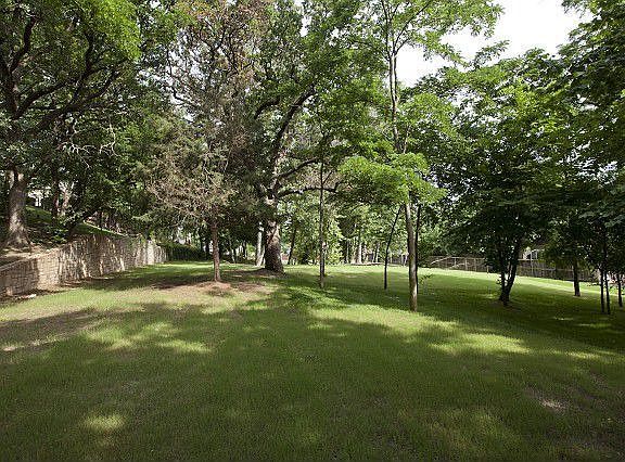 Park-like acreage with historical rock wall!