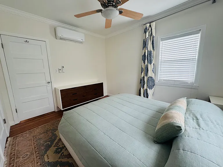 Wall unit air conditioning/heat and fan. Natural light.
