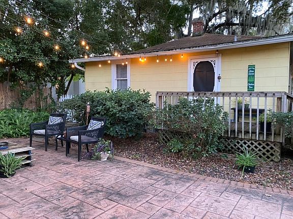 Rear of house with patio and small deck