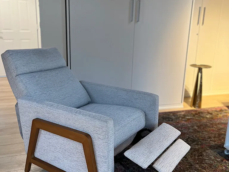 Comfy recliner with casters to move easily at bedtime