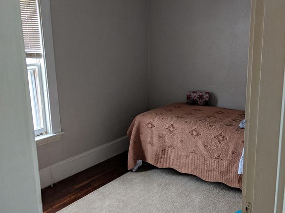 one of the two smaller bedrooms