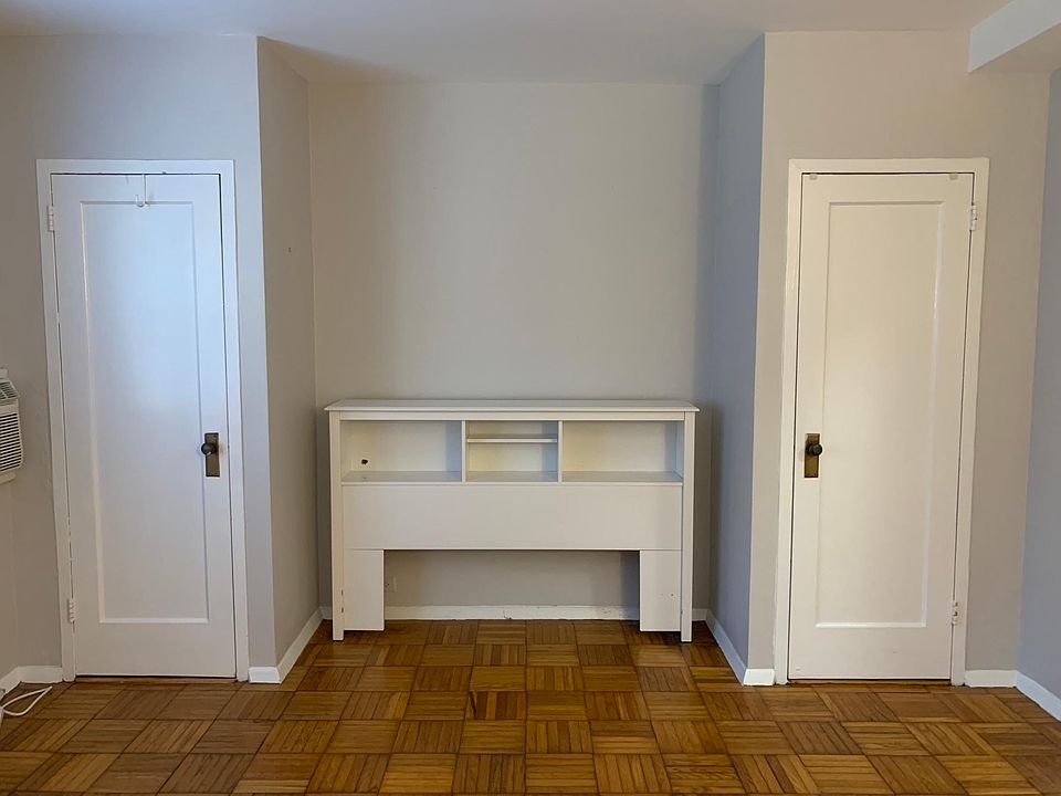 Bedroom with 2 closets and a nook- perfect for a desk or fits a queen size bed! (headboard has been removed)