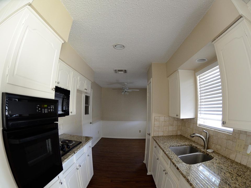 Kitchen with electric oven and stove, microwave, and dishwas