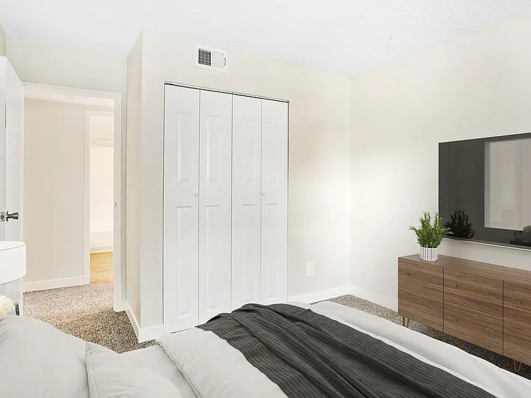 A Bedroom with Closet at Hilltop View Apartments