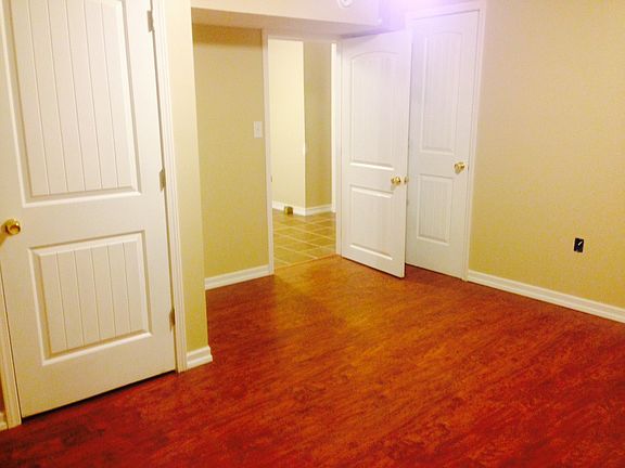 Bedroom with main closet behind door