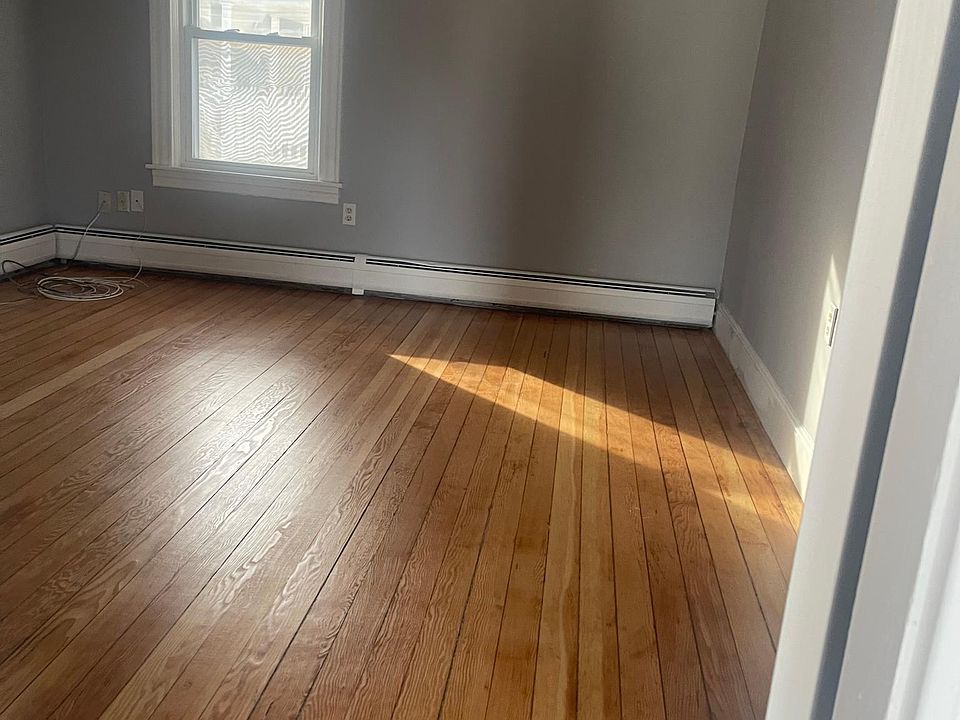 Freshly painted bedroom with refinished floors