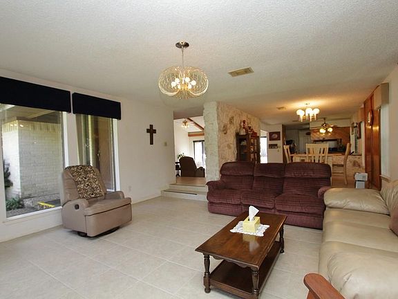 The Living Room is near the foyer and formal dining room with beautiful steps.