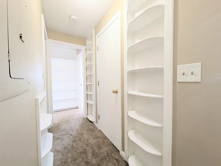 Hallway with custom-made shelves