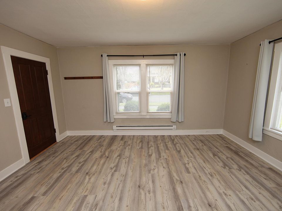 Living room and front door entrance into unit 1 (wide angle view)