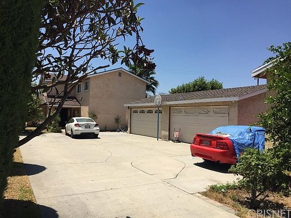 2 SEPARATE 2 CAR GARAGES FOR EACH HOUSE. VIEW OF THE REAR HOUSE (7140 LUXOR STREET)