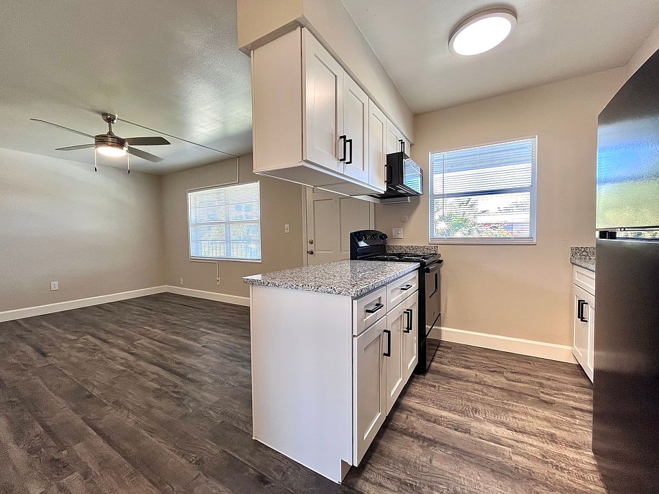 Step into sophistication with this beautifully designed open-concept kitchen and living space, perfect for contemporary living.