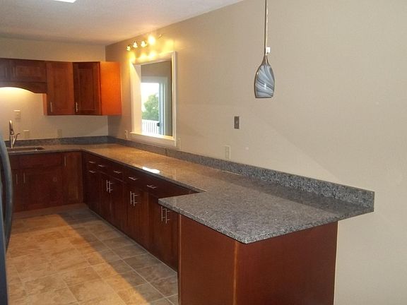 Kitchen has breakfast bar.