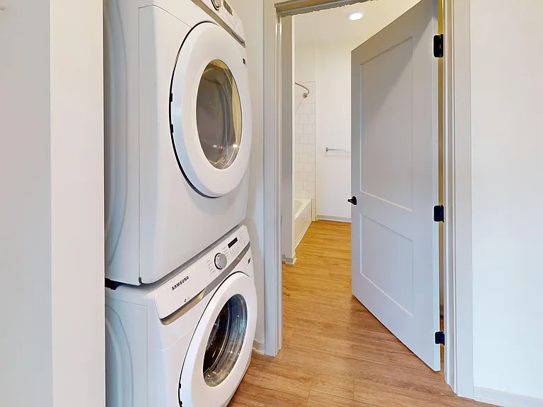 The washer and dryer in The Henry II floor plan is located in the walk-in closet, providing extra convenience. The washer and dryer in The Henry II floor plan is located in the walk-in closet, providing extra convenience.