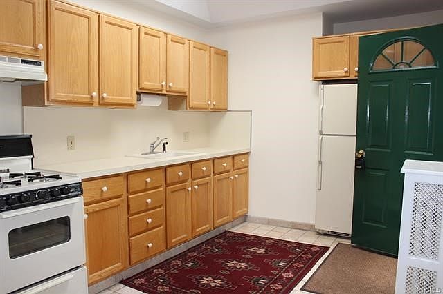 Enter into the sun filled kitchen with skylight. Private entrance into apartment.