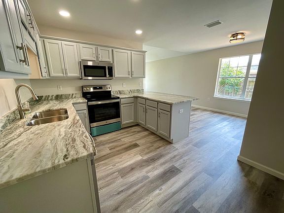 New stainless dishwasher, range & microwave