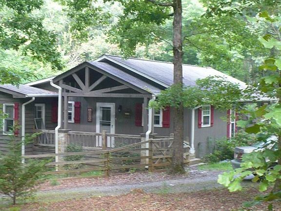 Cottage-style bungalow on acre lot