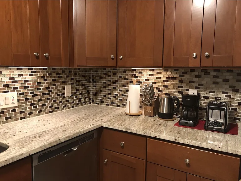 Small kitchen electronics, granite countertops, cabinets