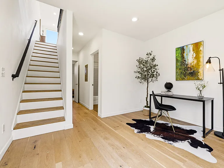Entrance + staircase to second floor