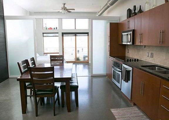 Open dining area. Lots of kitchen storage.