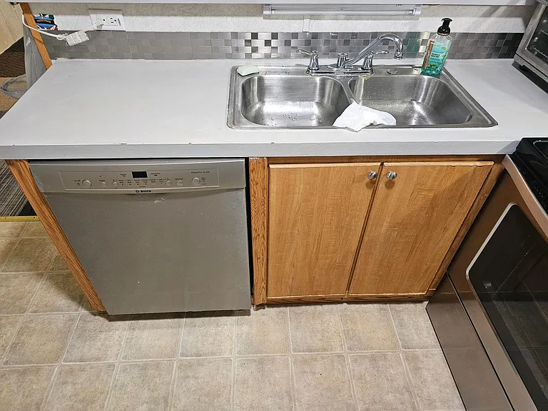 Newer dishwasher and backsplash