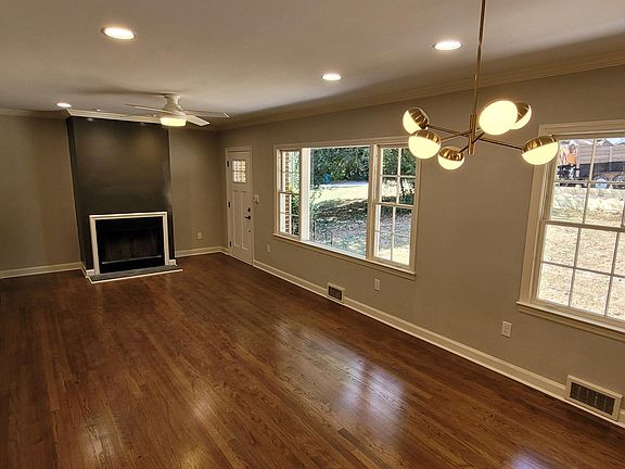 living room with working wood fireplace