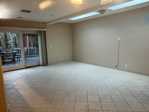 Living area with slider to deck