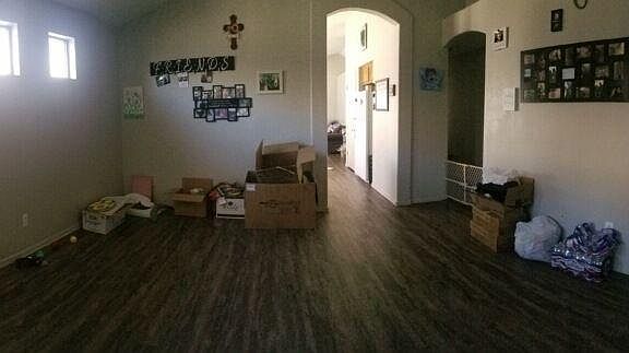 Front Room looking into kitchen; bedrooms down the right hallway