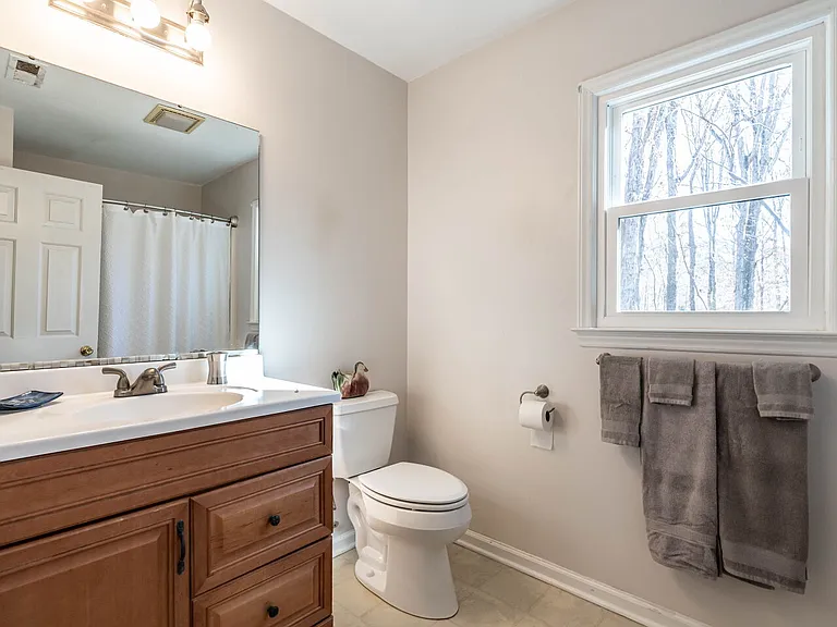 Upstairs bathroom has a fiberglass tub/shower