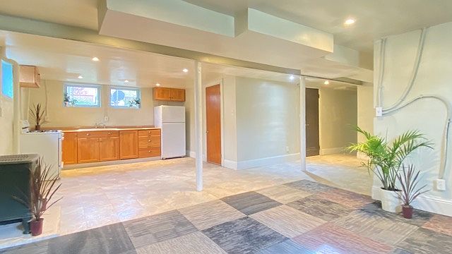 Large entryway expands to the open concept kitchen, dining and living area with abundant natural light.