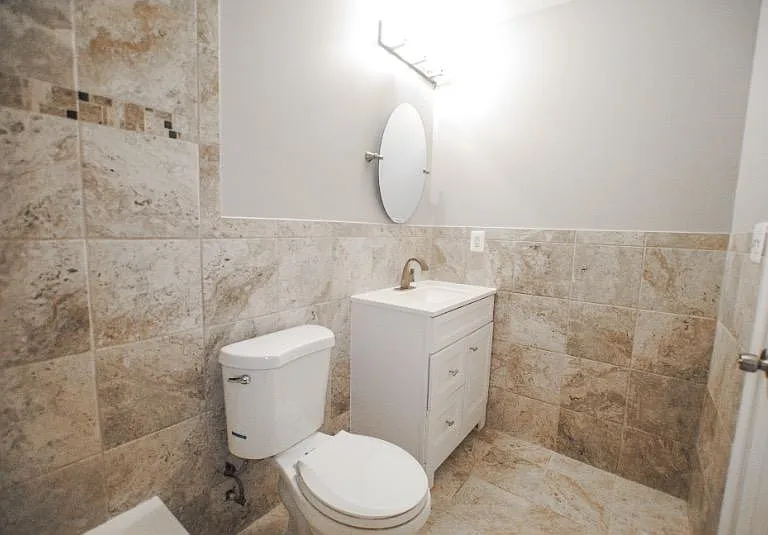 Head upstairs to find 2 bedrooms, a den, and bathroom