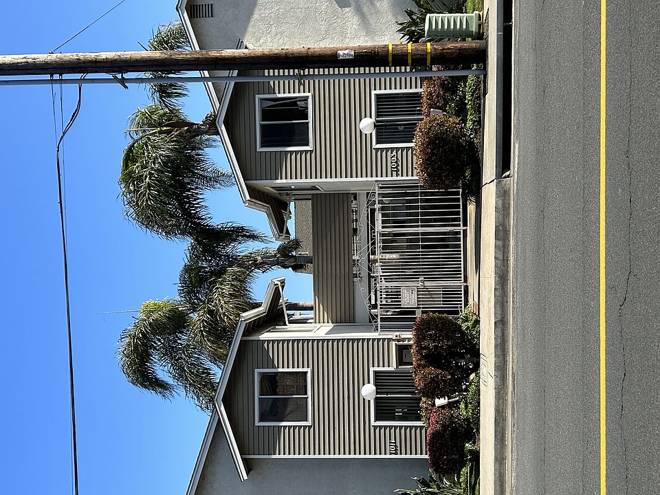 Street view of gated community at Carlsbad Sunset Apartments in Carlsbad, California.