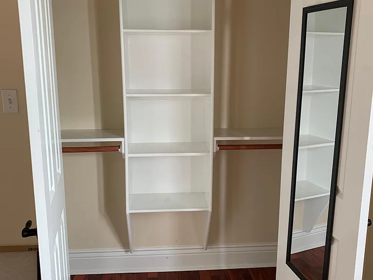 Second bedroom features a spacious closet with custom storage