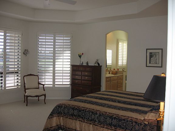 Master bedroom also has coffered ceiling, lots of south windows and opens into bath. Double sinks and separate shower and tub.