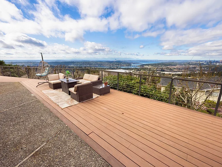 The patio features a comfortable sofa, creating a cozy outdoor space perfect for relaxing or enjoying conversations. Surrounded by serene views, it's an ideal spot for unwinding in the fresh air.
