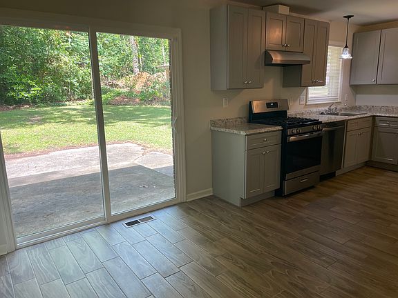 Big bright sliding door opens onto the patio and grassy back yard. Remember, lawn maintenance is included so you have more time to enjoy your patio.
