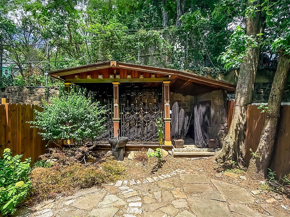 An inviting outdoor pavilion ideal for entertaining, rain or shine.