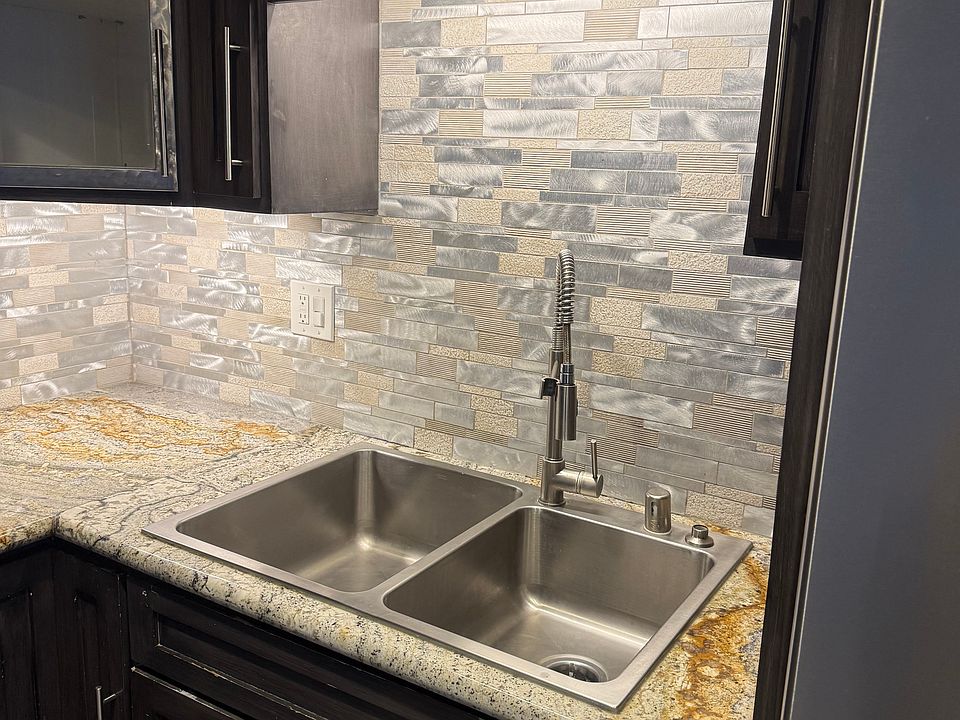 Custom everything! Won't find a back splash like this in any apartment!