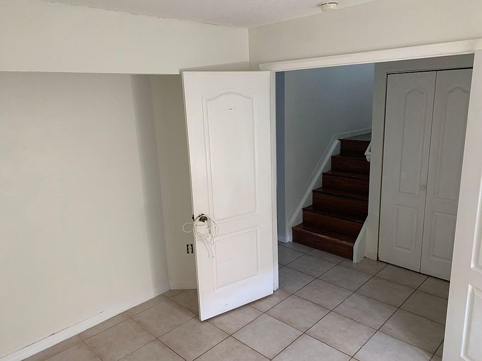 View of den, washer and dryer closet, entrance