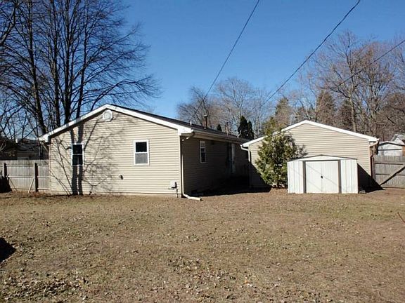 Fenced back yard there is a small storage shed included.