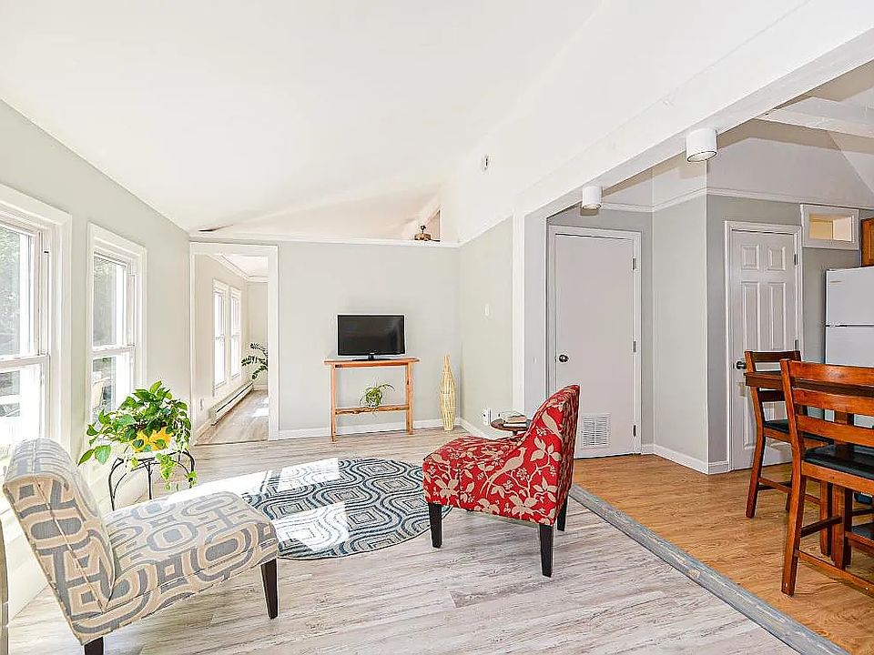 Bright, spacious living room with beautiful vaulted ceilings and natural light.