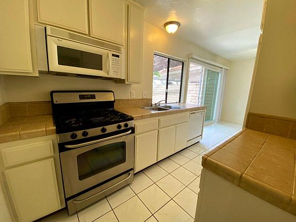 Kitchen, looking out, toward dining and patio