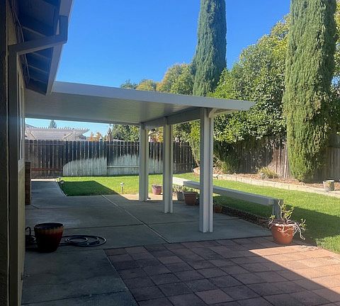 Back yard with covered patio
