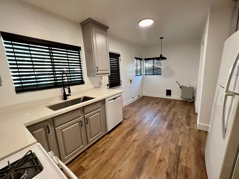 Kitchen with rear area for dining +laundry hookups