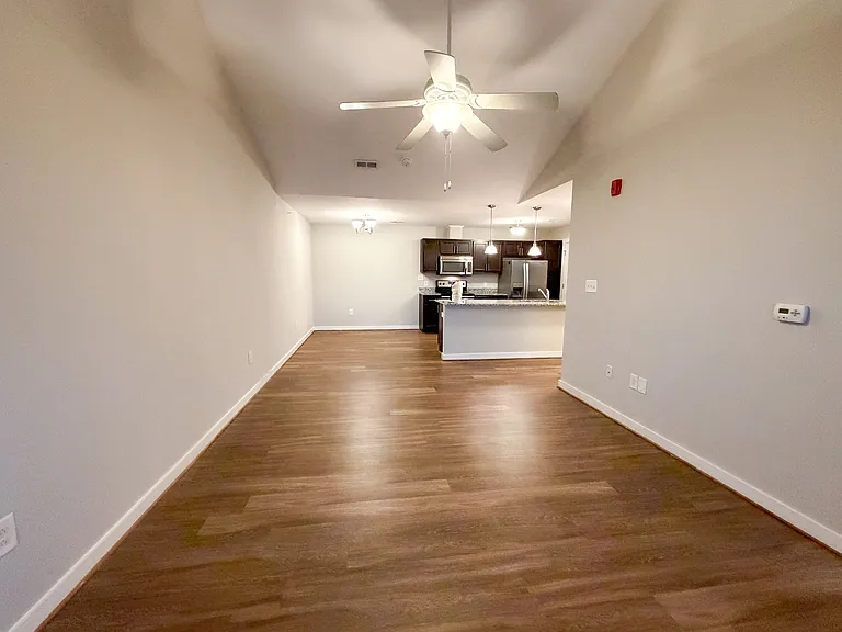 The open concept floorplan provides for a spacious dining, kitchen, and living space.