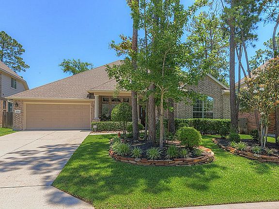 Lush landscaping and a 3 car tandem garage.